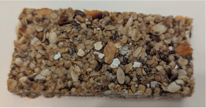 Granola bar with various ingredients on a white background